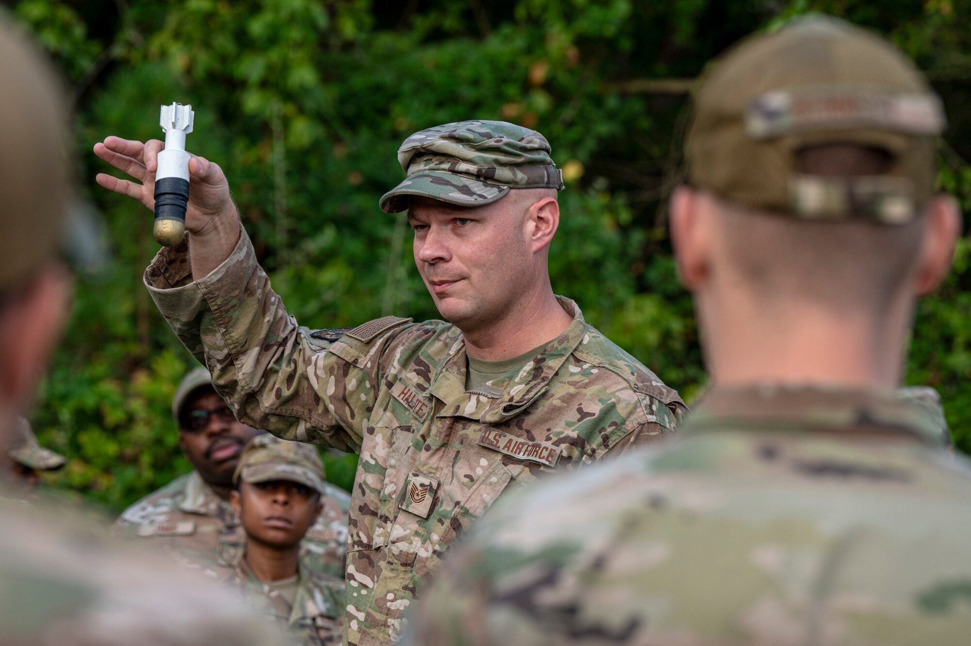 An Airman shows off an ordnance