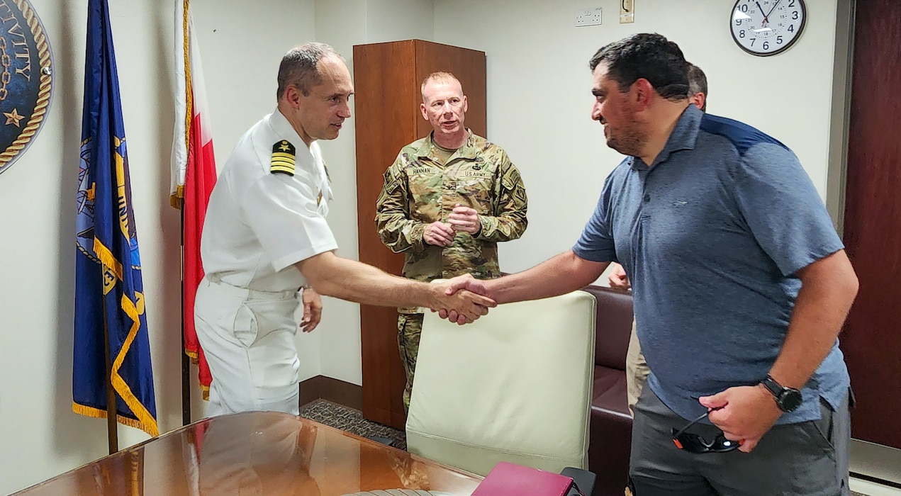 U.S. Navy Capt. Zachariah D. Aperauch, Commanding Officer of NSA Bahrain, shakes hands with U.S. Army Corps of Engineers Transatlantic Middle East District Bahrain Area Office personnel during a site visit to view ongoing base infrastructure projects supporting U.S. Naval Forces Central Command and Naval Support Activity Bahrain, Sept. 11, 2023.