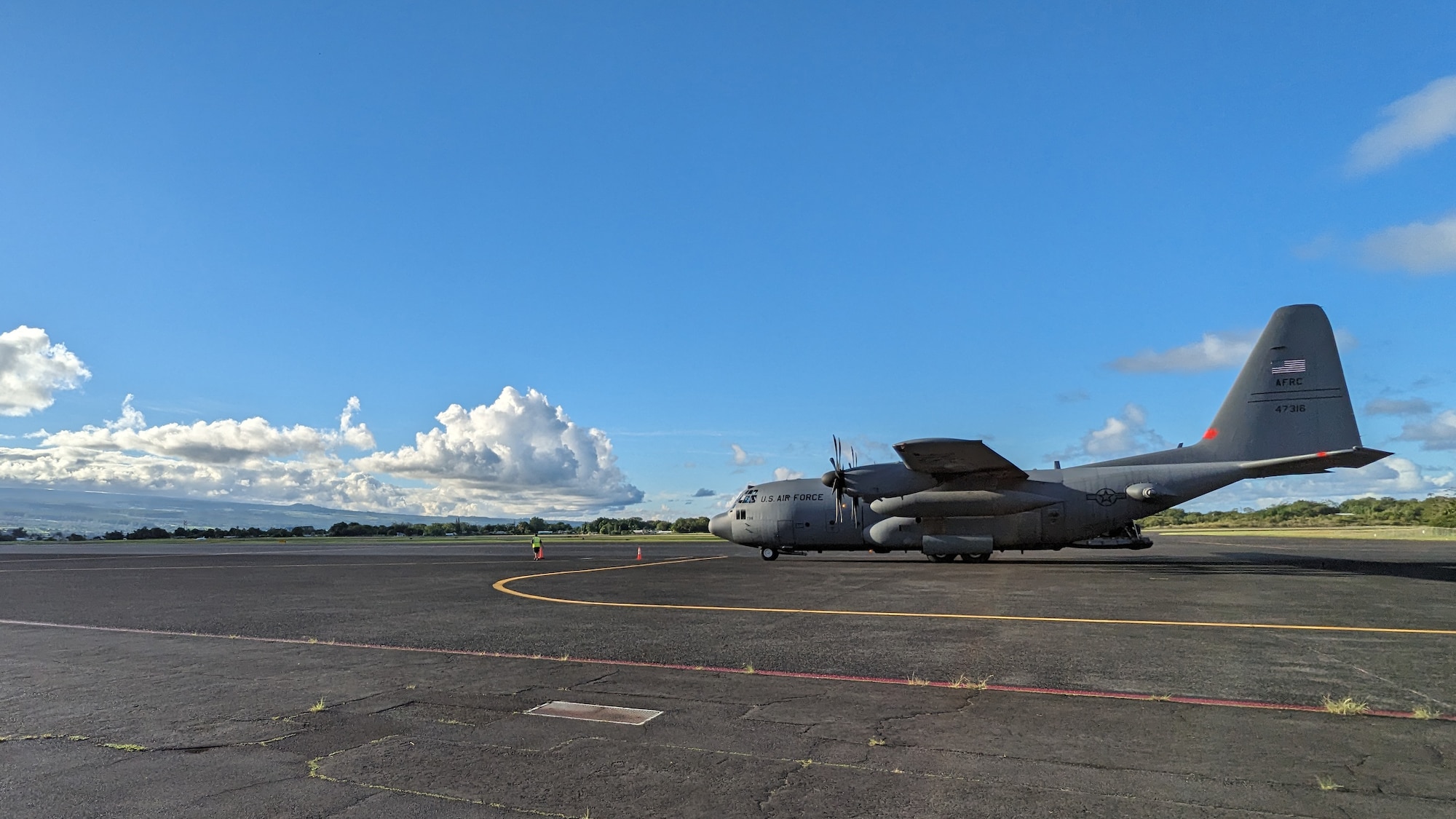 C-130H Hercules from the 302nd Airlift Wing drops off cargo and passengers for Rally in the Pacific 2023 exercise.