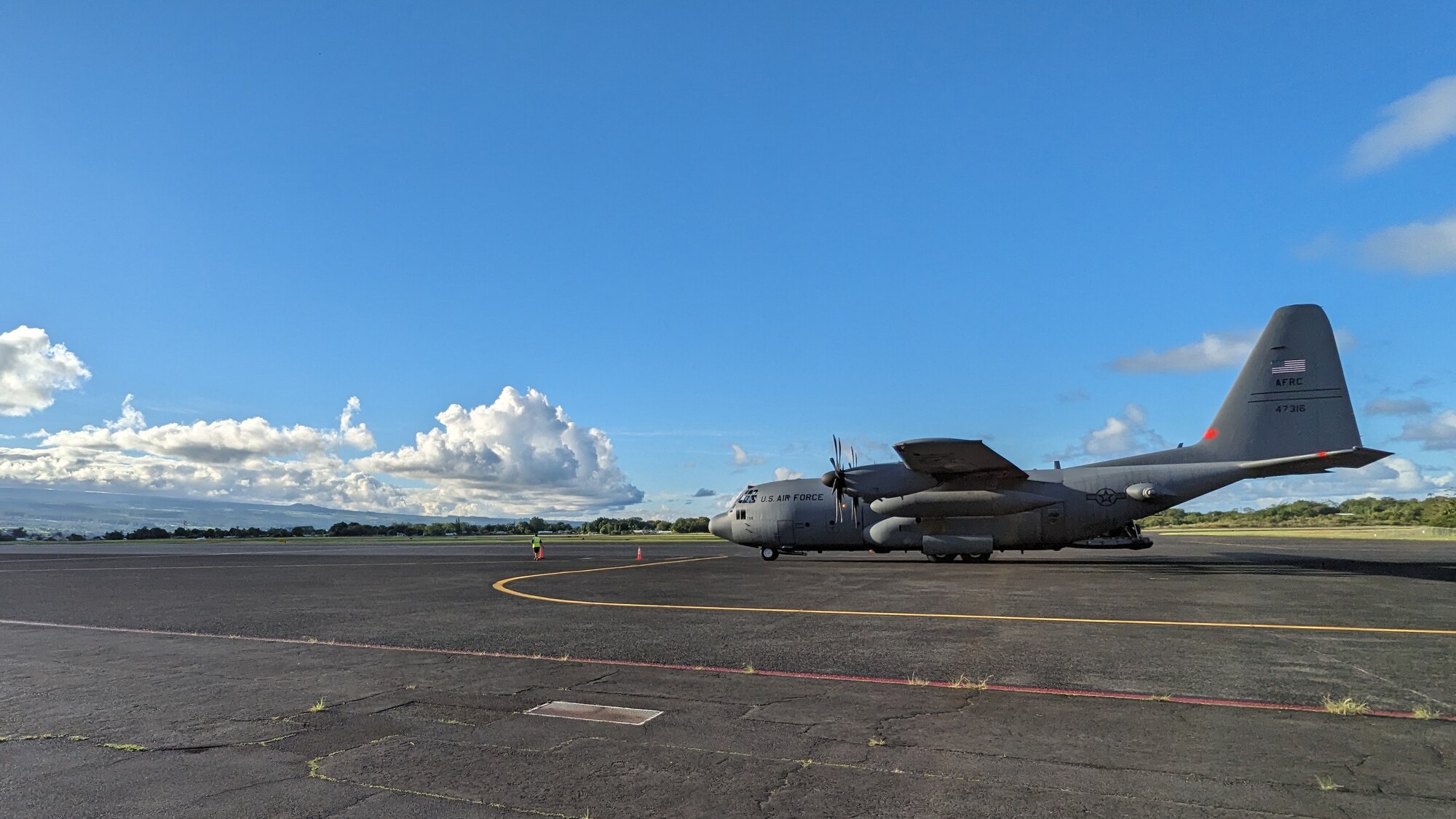 C-130H Hercules from the 302nd Airlift Wing drops off cargo and passengers for Rally in the Pacific 2023 exercise.