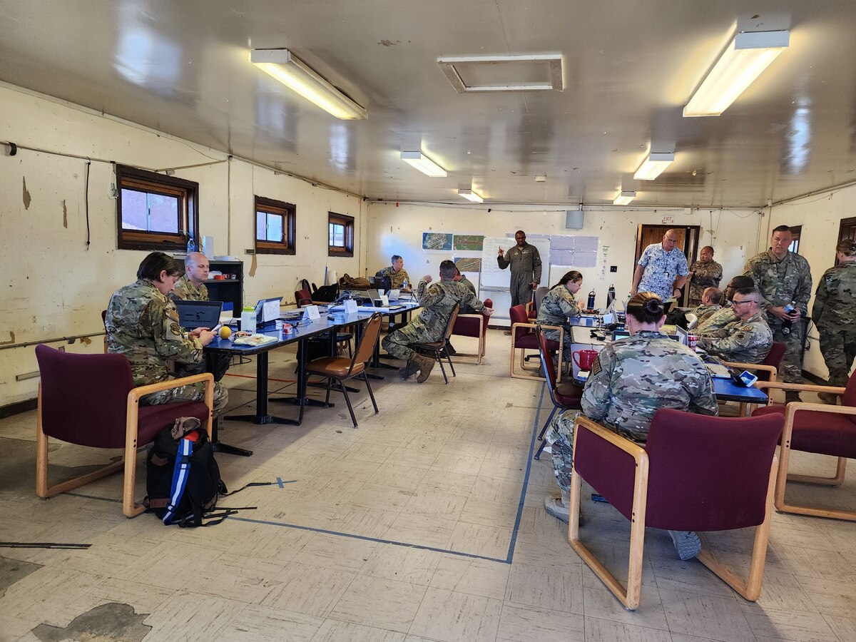 Members across multiple 22nd Air Force Reserve units work together at an austere work station to form the command staff for the Rally in the Pacific 2023,