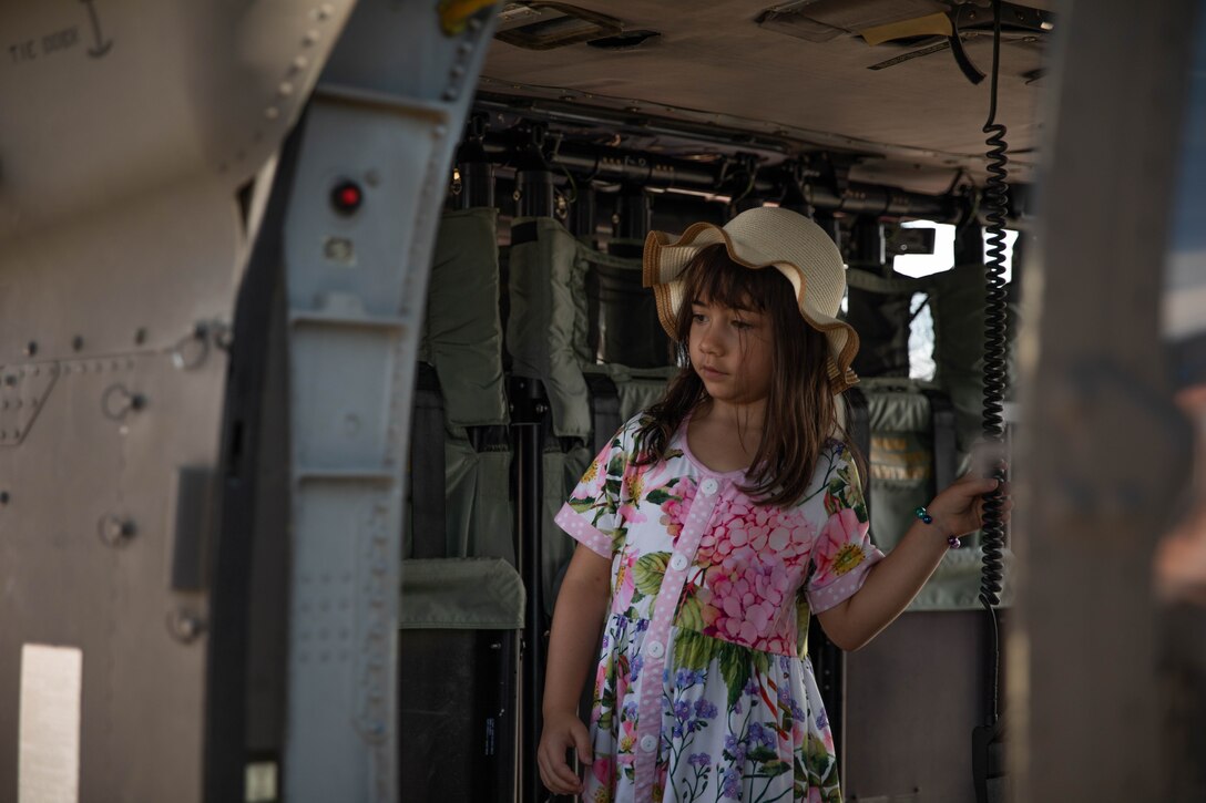 A child explores the rear of a UH-60 Black Hawk at the 2023 Frankfort Aviation day in Frankfort, Kentucky, Sept. 16, 2023. Visitors to the event had the opportunity to explore Kentucky Army National Guard Aviation assets in static displays. (U.S. Army National Guard photo by Spc. Caleb Sooter)