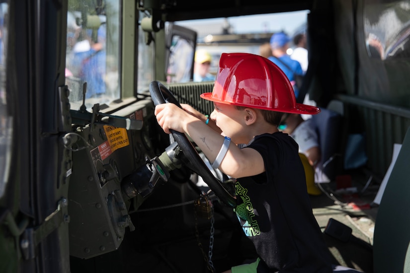 A child sits in the driver’s seat of a Humvee at the 2023 Frankfort Aviation Day in Frankfort, Kentucky, Sept. 16, 2023. The Frankfort Aviation Day formed a critical moment of connection between Kentucky Army National Guard Aviators and the people of Frankfort. (U.S. Army National Guard photo by Spc. Caleb Sooter)
