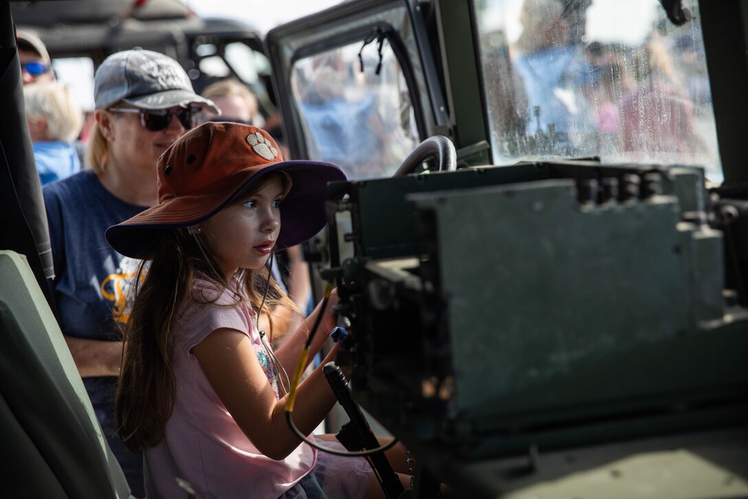 A child sits in a Humvee at the 2023 Frankfort Aviation Day in Frankfort, Kentucky, Sept. 16, 2023. The Frankfort Aviation Day formed a critical moment of connection between Kentucky Army National Guard Aviators and the people of Frankfort. (U.S. Army National Guard photo by Spc. Caleb Sooter)