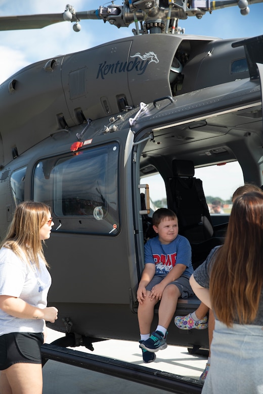 A child sits in a UH-60 Black Hawk at the 2023 Frankfort Aviation Day in Frankfort, Kentucky, Sept. 16, 2023. The Frankfort Aviation Day formed a critical moment of connection between Kentucky Army National Guard Aviators and the people of Frankfort. (U.S. Army National Guard photo by Spc. Caleb Sooter)