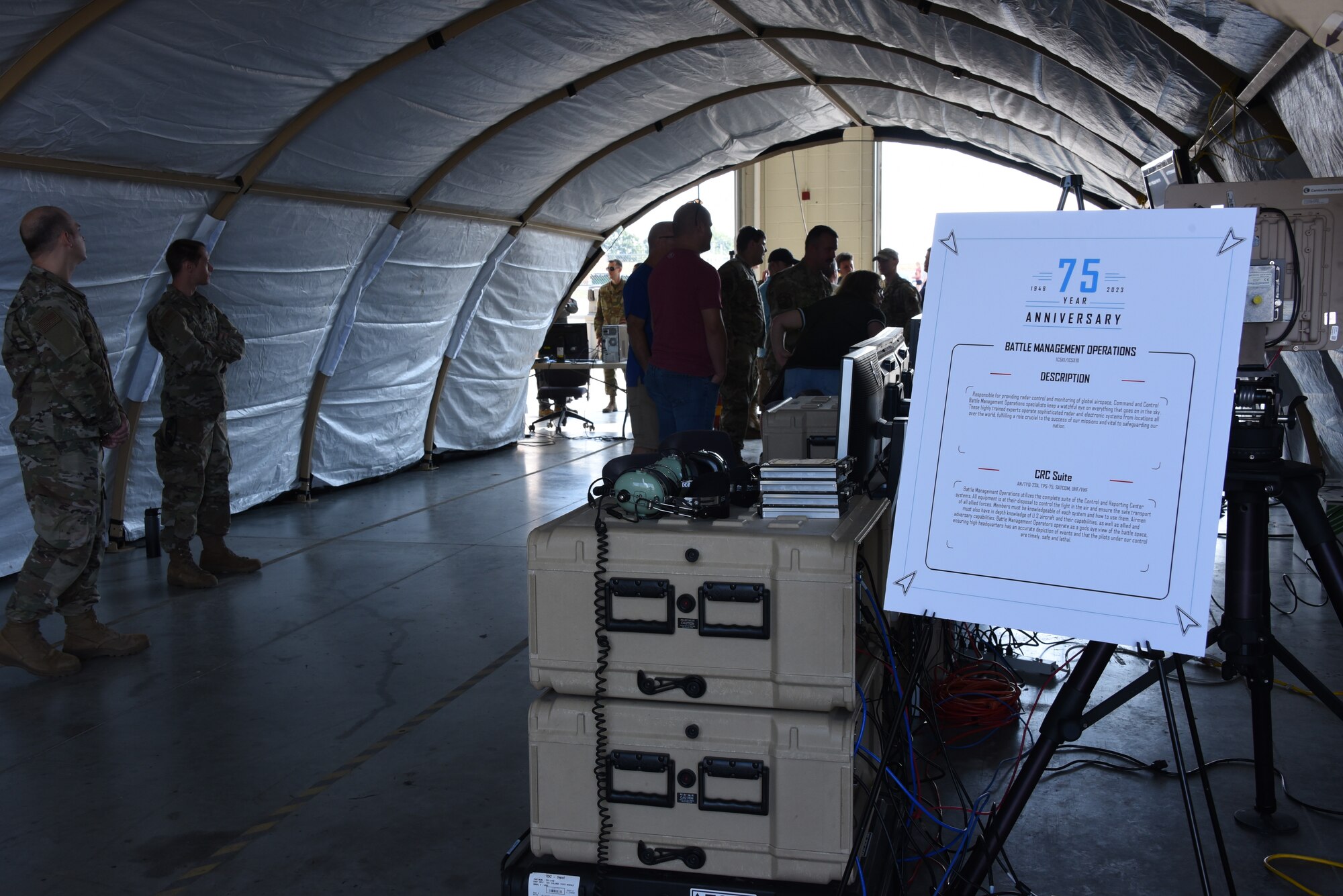 Visitors to the 133rd Test Squadron 75th Anniversary open house event look at a battle management command-and-control suite