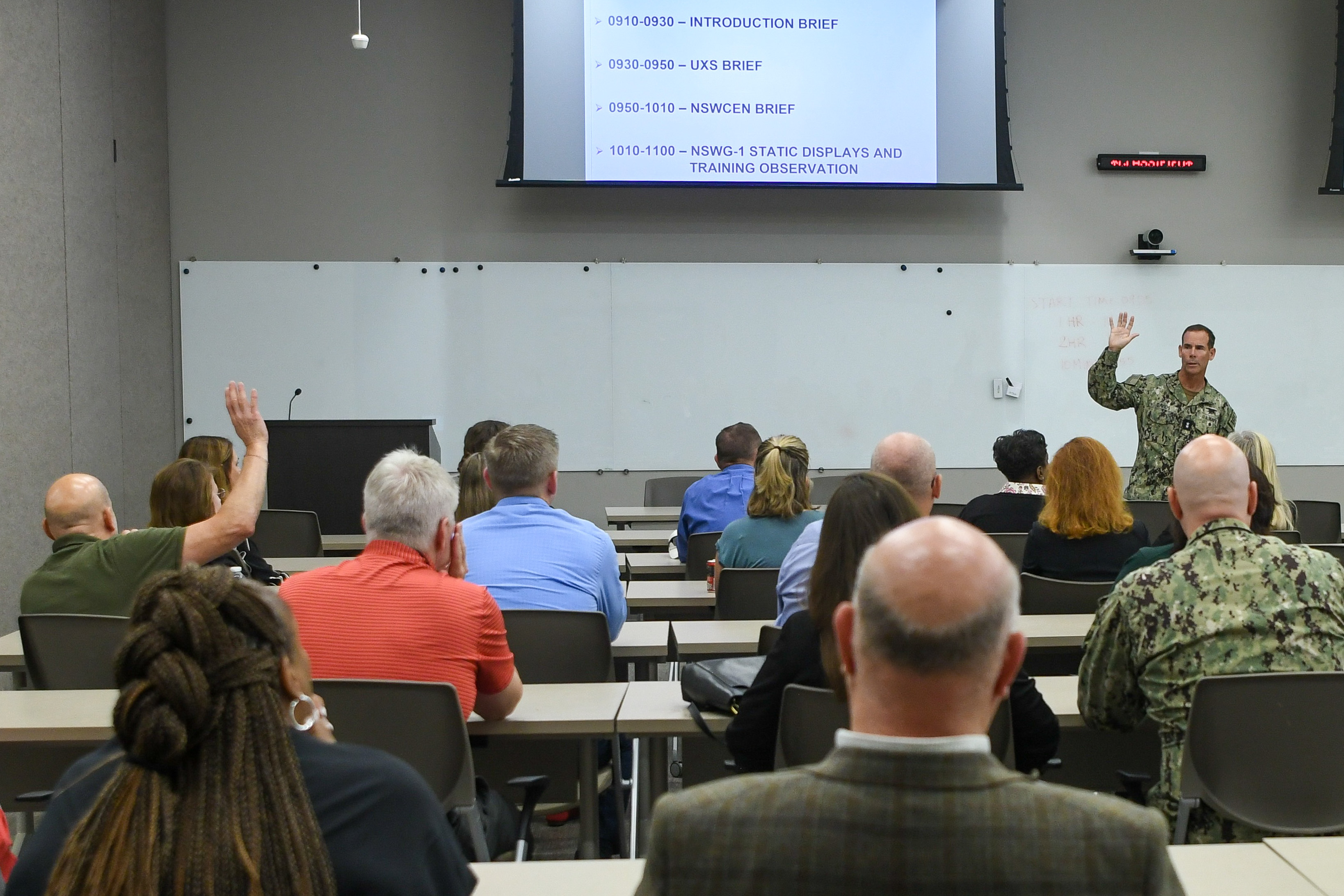 Commander, NSWC, Briefs APEX Attendees