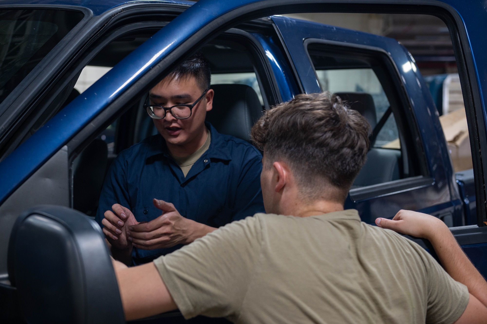 U.S. Air Force Airmen from the 36th Logistics Readiness Squadron, vehicle maintenance flight, service a truck on Andersen Air Force Base, Guam, Sept. 11, 2023. Post typhoon, the vehicle maintenance flight processed two thousand parts requests and coordinated with 45 local and stateside vendors returning 370 vehicles to be fully mission capable. (U.S. Air Force photo by Airman Allon Lapaix)