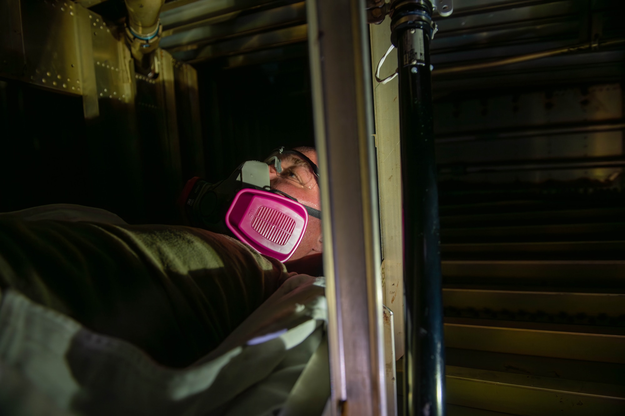 TSgt. Thompson inspecting the inside of a KC-135 fuel tank