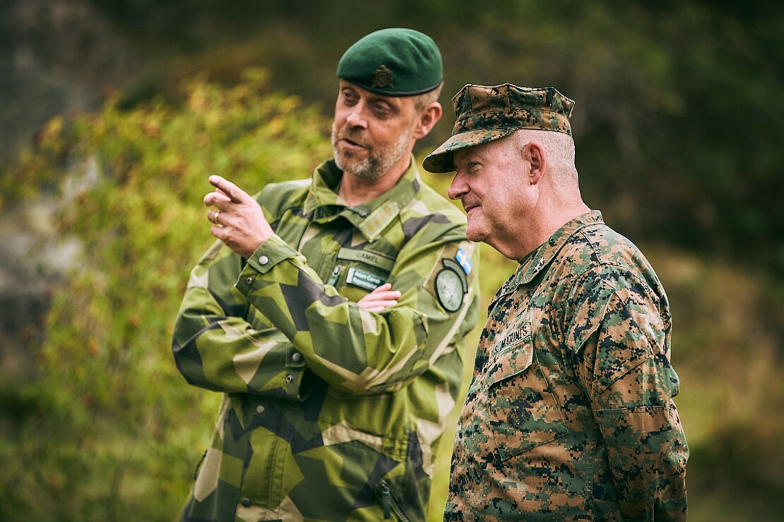 U.S. Marine Corps Maj. Gen. Robert B. Sofge Jr., commanding general of Marine Forces Europe and Africa, right, and Swedish Col. Adam Camel, commanding officer of Stockholm Marine Regiment (Amf 1), interact during exercise Archipelago Endeavor 23 in Sweden on Sept. 13, 2023. Exercise Archipelago Endeavor is an integrated, Swedish Armed Forces-led exercise that increases operational capability and enhances strategic cooperation between the U.S. Marines and Swedish forces. (U.S. Marine Corps photo by Staff Sergeant Donato Maffin)