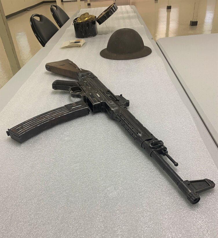 A first-generation Sturmgewehr 44 assault rifle, used by the German forces during World War II. This rifle holds historical significance as it was pierced by a round during the Battle of the Bulge, where Soldiers of the 28th Division valiantly defended an extended front against a German offensive. (U.S. National Guard photo by Capt. Michael Sprowles)