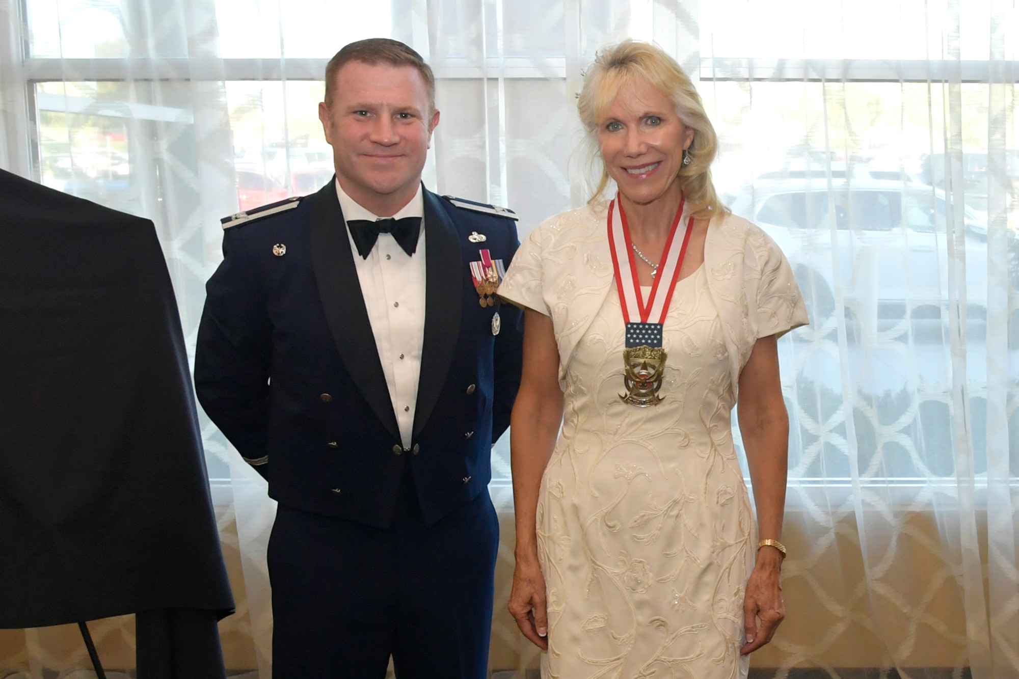 Susan Davis stands next to Col. Jeffrey Holland.