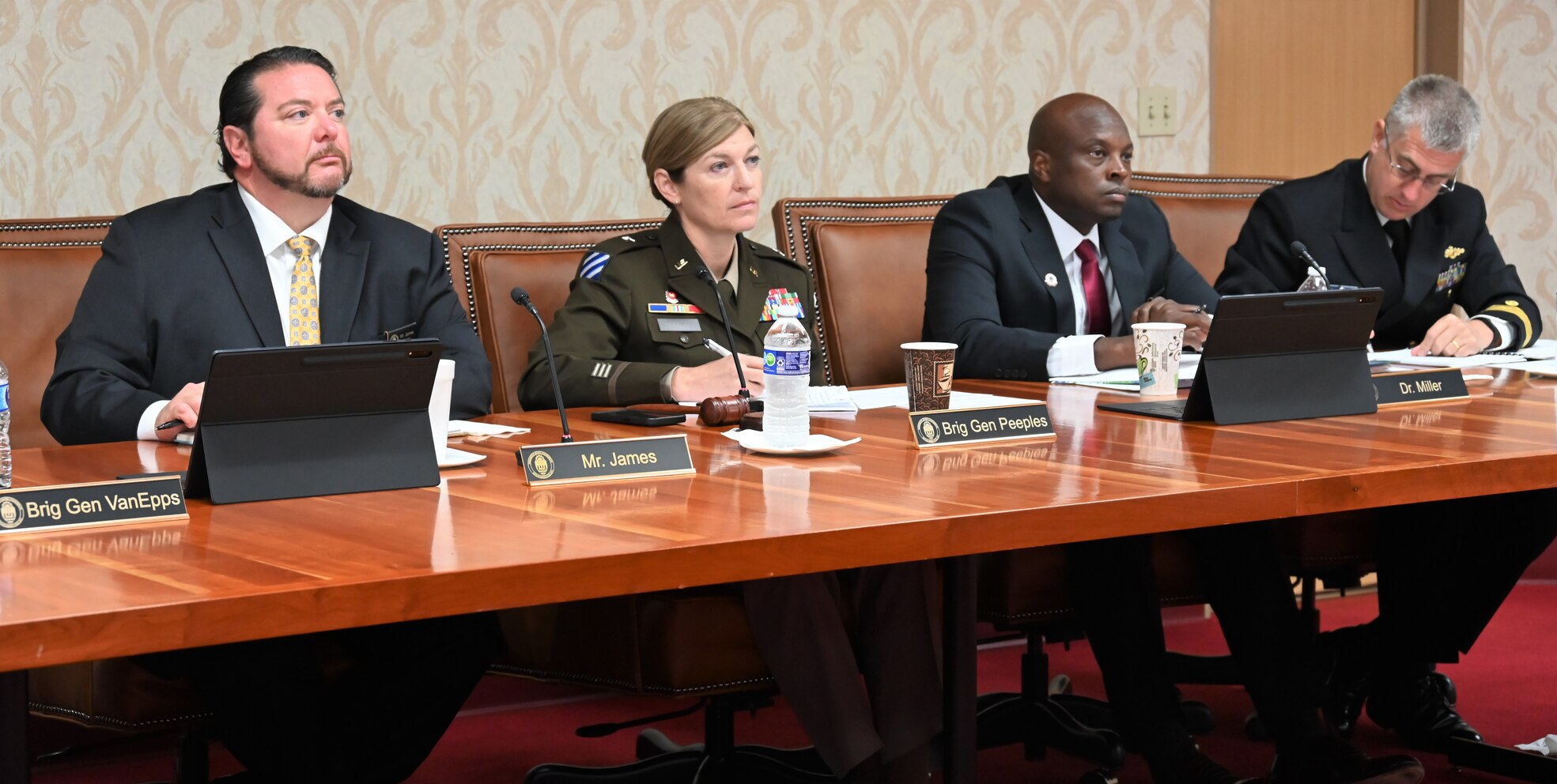 Members of the MRC Commission sitting at table listening and taking notes as the public presented testimony during the 409th session of the MRC low-water inspection trip.