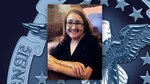 Head and shoulders picture of a woman with long hair and glasses