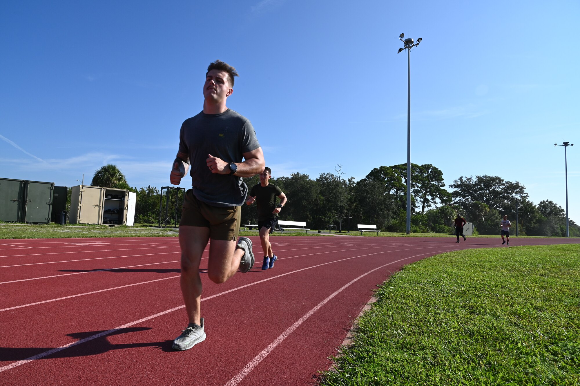 Service members at MacDill Air Force Base, run in a fitness competition during Helton Week, Florida, Sept. 13, 2023.
