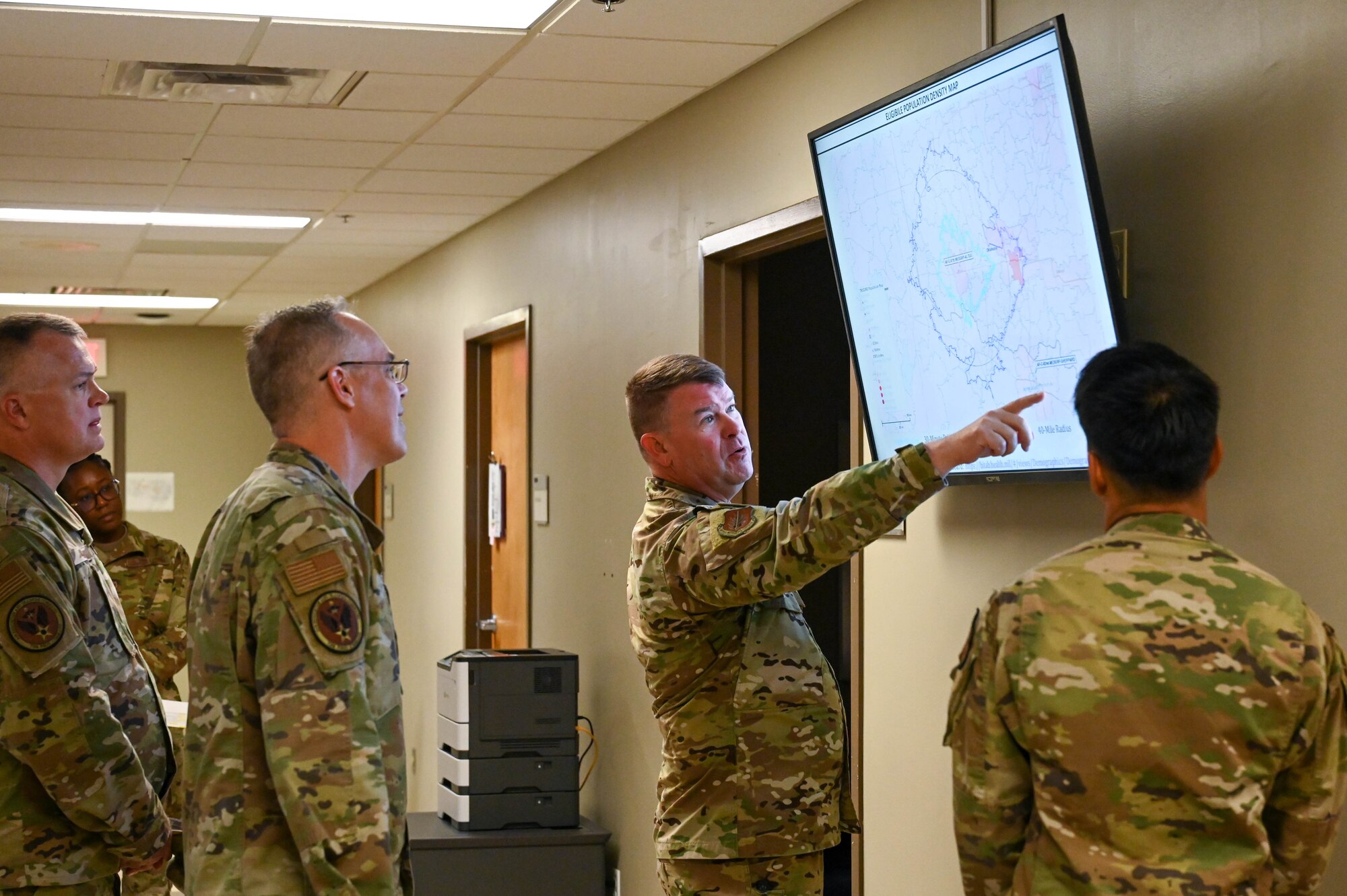 From right, U.S. Air Force Col. Daniel Roberts, 97th Medical Group commander, shows Col. Christopher Grussendorf, Air Education and Training Command (AETC) surgeon general, and Chief Master Sgt. Donald Cook, AETC chief of enlisted medical force, a digital map of Altus and surrounding areas during a tour of the medical group facility at Altus Air Force Base, Oklahoma, Sept. 13, 2023. Members of the medical group deliver patient-centered healthcare and are responsible for ensuring wartime readiness and the health of Airmen and their families. (U.S. Air Force photo by Airman 1st Class Heidi Bucins)