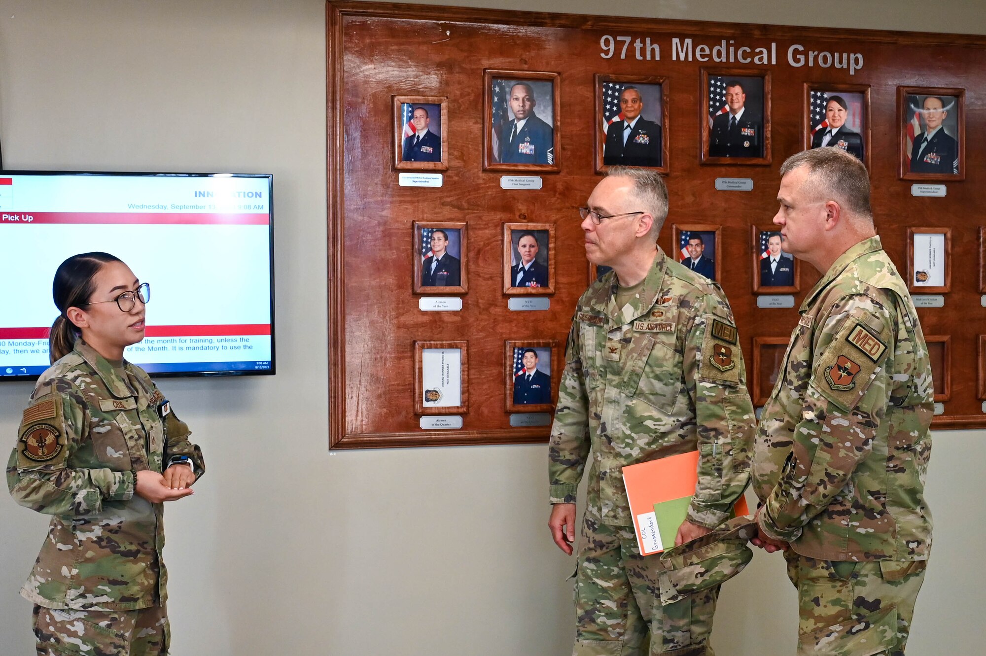 From left, U.S. Air Force Staff Sgt. Margaret Celis, 97th Operational Medical Readiness Squadron pharmacy technician, explains current pharmacy programs to Col. Christopher Grussendorf, Air Education and Training Command (AETC) surgeon general, and Chief Master Sgt. Donald Cook, AETC chief of enlisted medical force, during a base tour of the medical group facility, Sept. 13, 2023, at Altus Air Force Base, Oklahoma. The pharmacy offers an over-the-counter program that helps patients experiencing allergies and common cold and flu symptoms to get access to medications and doesn’t require a doctor's visit.  (U.S. Air Force photo by Airman 1st Class Heidi Bucins)