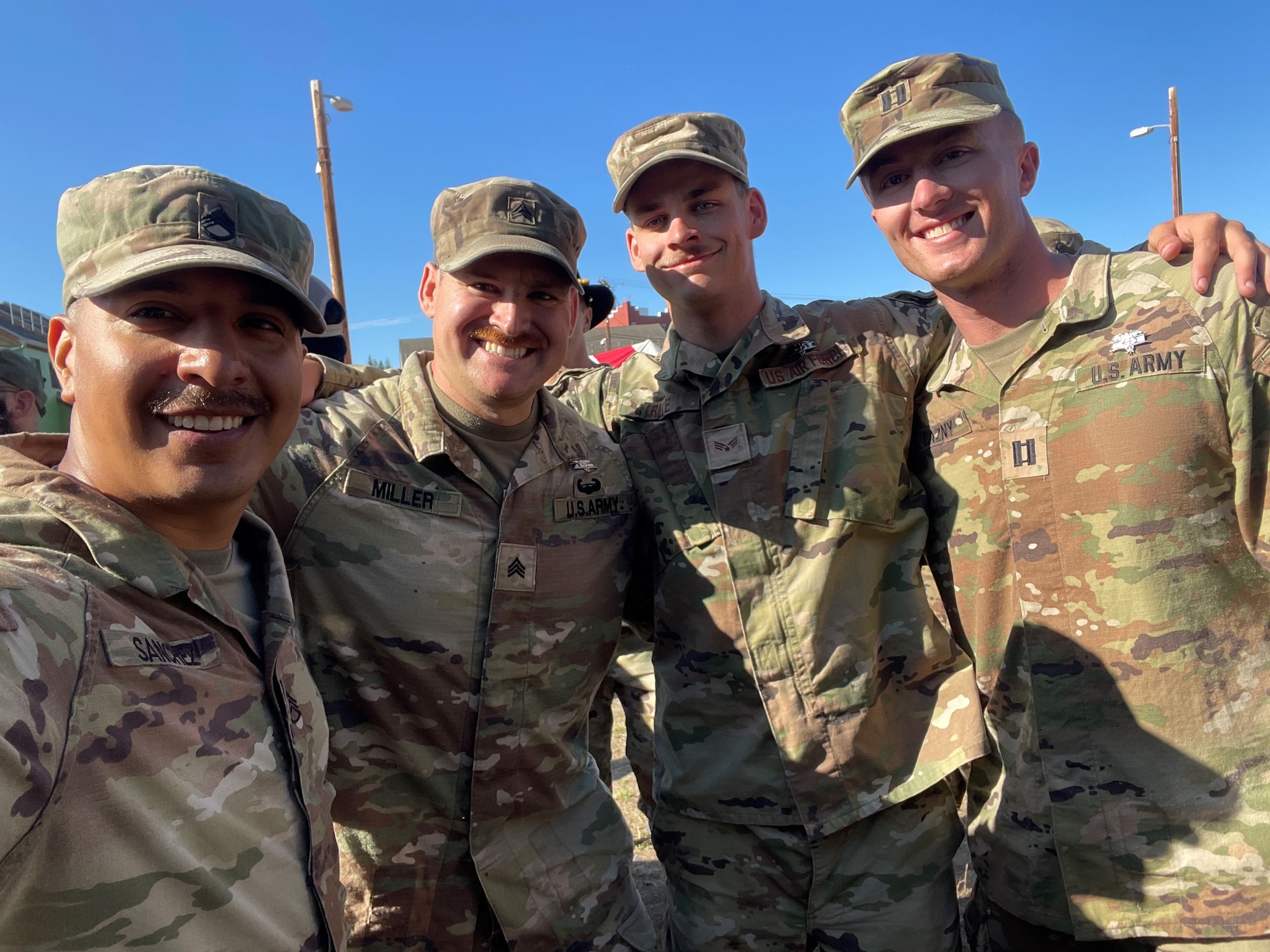 U.S. Air Force Senior Airman Tavin Rice (third from the left), 354th Medial Group Aerospace Medical Technician, and three Army soldiers receive the Expert Field Medical Badge at Fort Wainwright, Alaska, July 21, 2023.