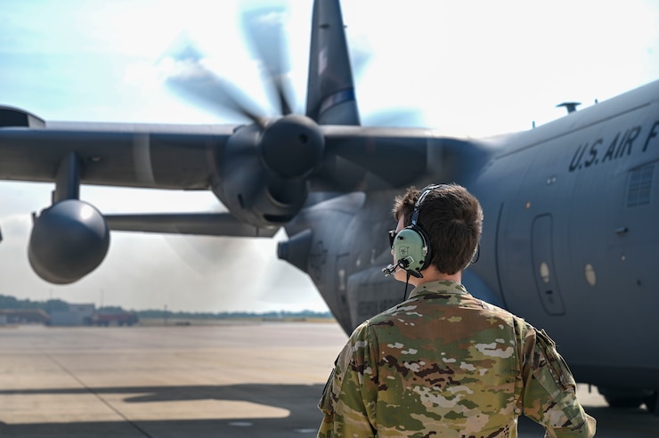 United States Airman communicates with pilots.