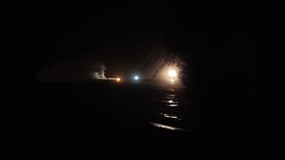 A burning flare in the night during search for survivors of a capsized migrant vessel just off Mona Island, Puerto Rico, Sept. 18, 2023.  Coast Guard air and surface units combined efforts with local park rangers and the M/F Kydon ferry crew to rescue one migrant from the water and five others who safely reached Mona Island’s Sardinera Beach. (Courtesy photo)