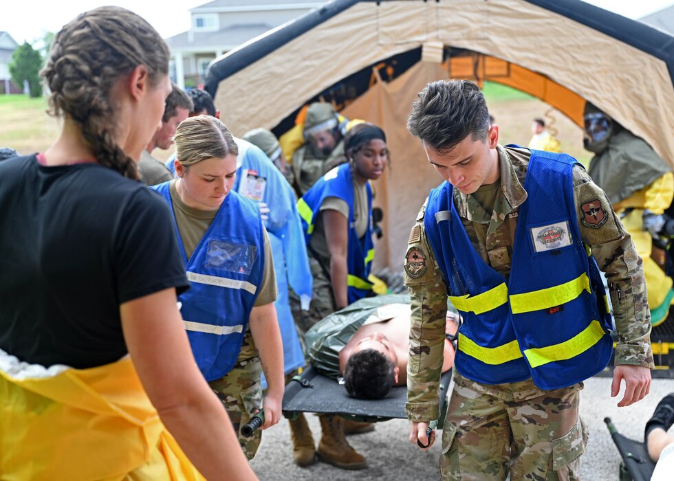 Airmen assigned to the 17th Medical Group carry a simulated patient during a Ready EAGLE II exercise at Goodfellow Air Force Base, Texas, Sept. 14, 2023. Patients were removed from the decontamination and placed on the ground for simulated secondary medical care. (U.S. Air Force photo by Senior Airman Sarah Williams)