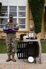 U.S. Marine Corps Cpl. Malachi Groff, a military police officer with Headquarters and Service Battalion, Marine Corps Recruit Depot San Diego, stands with the American flag presented in honor of his Military Working Dog Nero, during a memorial ceremony at MCRD San Diego, Sept. 18, 2023. MWD Nero showed great dedication and courage while working on MCRD San Diego from June 11, 2021 through Sept. 9, 2023. (U.S. Marine Corps photo by Sgt. Yvonna Guyette)