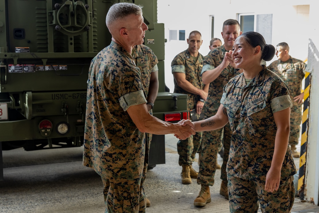 12 Sep 23 - Sgt Ana Martinez is “coined” by the Assistant Commandant of the Marine Corps, General Smith, for sustained outstanding performance of her duties at MCAS Futenma.