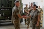 12 Sep 23 - Sgt Ana Martinez is “coined” by the Assistant Commandant of the Marine Corps, General Smith, for sustained outstanding performance of her duties at MCAS Futenma.