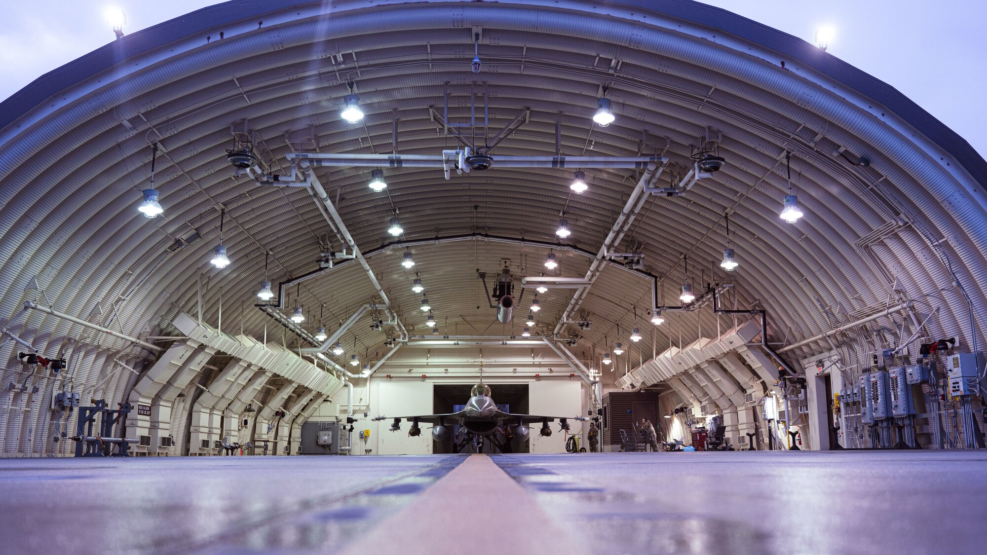 Maintainers with the 80th Fighter Generation Squadron prepare an F-16 Fighting Falcon for a pre-flight inspection.