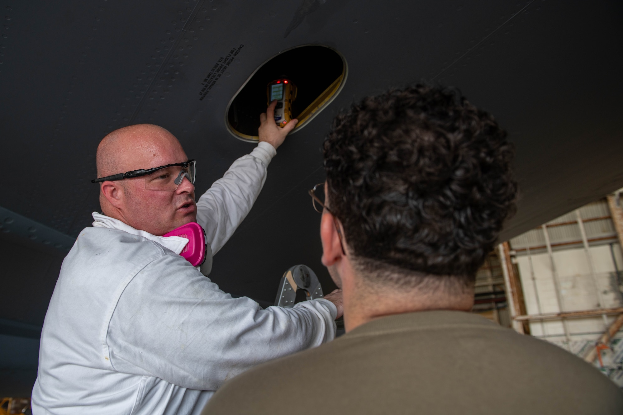 TSgt. Thompson instructing A1C Edson on the use of a PID.