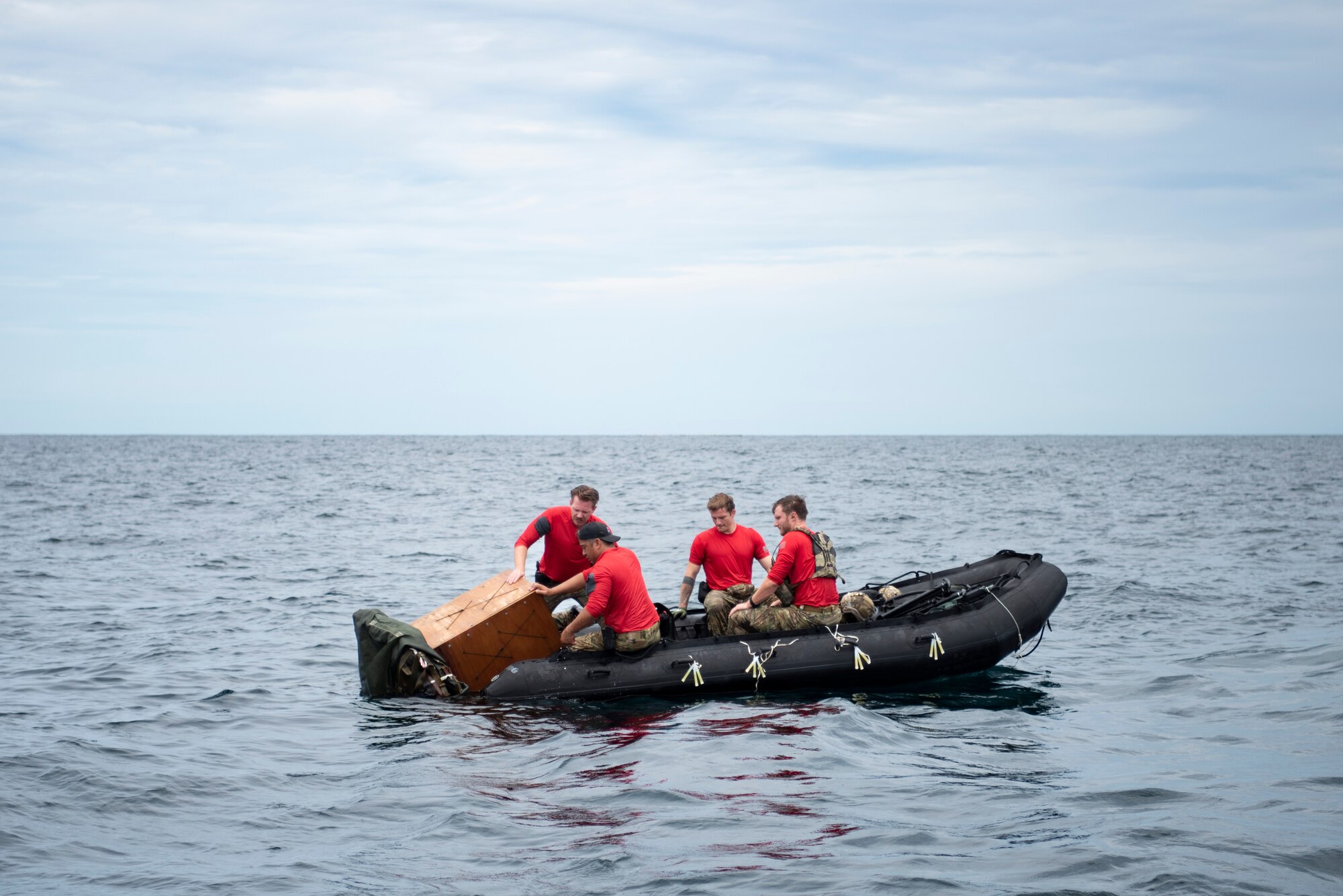 Photo of pararescuemen on an inflatable watercraft