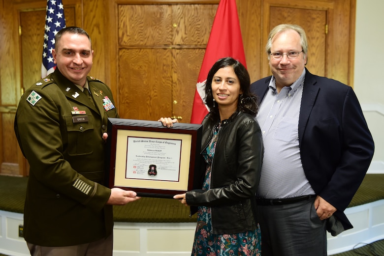 Rebecca Midkiff, U.S. Army Corps of Engineers Nashville District, receives a certificate of completion for the 2023 Leadership Development Program Level I Course from Lt. Col. Robert W. Green, Nashville District commander, and Michael Evans, course instructor, during a graduation ceremony Sept. 13, 2023, at the Scarritt Bennett Center in Nashville, Tennessee. (USACE Photo by Lee Roberts)