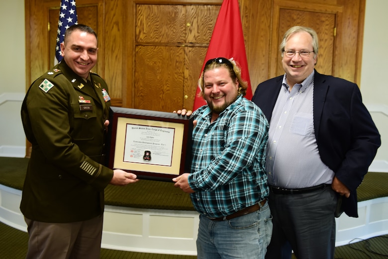 Lee Kipke, U.S. Army Corps of Engineers Nashville District, receives a certificate of completion for the 2023 Leadership Development Program Level I Course from Lt. Col. Robert W. Green, Nashville District commander, and Michael Evans, course instructor, during a graduation ceremony Sept. 13, 2023, at the Scarritt Bennett Center in Nashville, Tennessee. (USACE Photo by Lee Roberts)