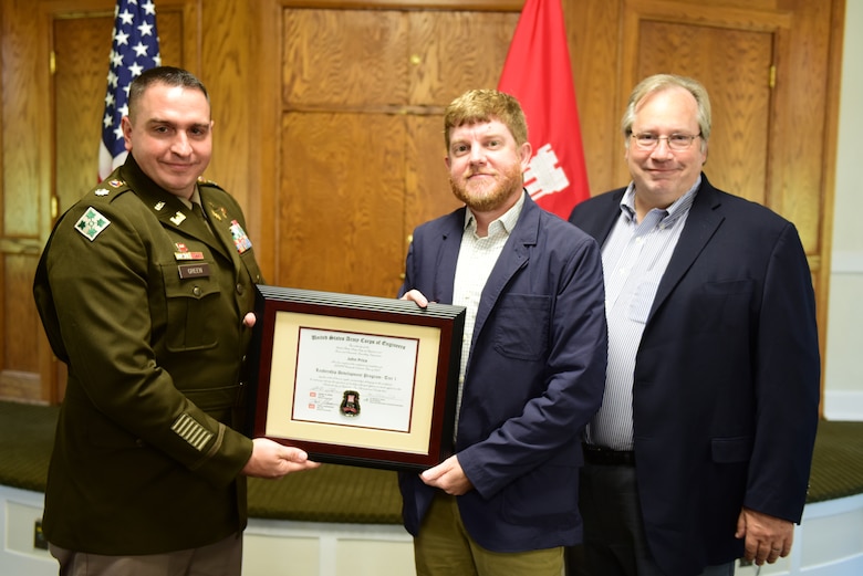 John Price, U.S. Army Corps of Engineers Nashville District, receives a certificate of completion for the 2023 Leadership Development Program Level I Course from Lt. Col. Robert W. Green, Nashville District commander, and Michael Evans, course instructor, during a graduation ceremony Sept. 13, 2023, at the Scarritt Bennett Center in Nashville, Tennessee. (USACE Photo by Lee Roberts)