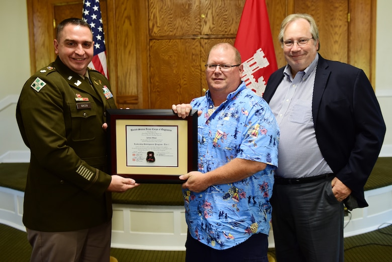 Jim Mays, U.S. Army Corps of Engineers Nashville District, receives a certificate of completion for the 2023 Leadership Development Program Level I Course from Lt. Col. Robert W. Green, Nashville District commander, and Michael Evans, course instructor, during a graduation ceremony Sept. 13, 2023, at the Scarritt Bennett Center in Nashville, Tennessee. (USACE Photo by Lee Roberts)