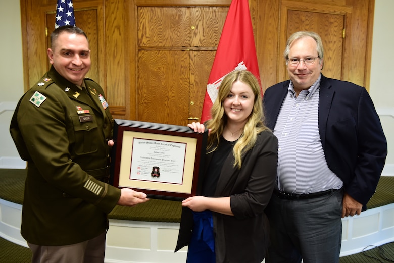 Bailey Carter, U.S. Army Corps of Engineers Nashville District, receives a certificate of completion for the 2023 Leadership Development Program Level I Course from Lt. Col. Robert W. Green, Nashville District commander, and Michael Evans, course instructor, during a graduation ceremony Sept. 13, 2023, at the Scarritt Bennett Center in Nashville, Tennessee. (USACE Photo by Lee Roberts)