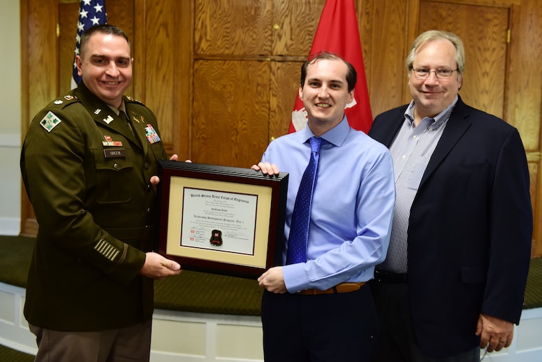 Andrew Roth, U.S. Army Corps of Engineers Nashville District, receives a certificate of completion for the 2023 Leadership Development Program Level I Course from Lt. Col. Robert W. Green, Nashville District commander, and Michael Evans, course instructor, during a graduation ceremony Sept. 13, 2023, at the Scarritt Bennett Center in Nashville, Tennessee. (USACE Photo by Lee Roberts)
