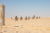 UDAIRI RANGE COMPLEX, Kuwait (Sept. 6, 2023) – Kuwaiti Marines prepare to unmask a squad attack while supported by suppressing fires from a squad of U.S. Marines during an integrated platoon reinforced live-fire attack at Udairi Range Complex, Kuwait, Sept. 6, 2023. Elements of the 26th Marine Expeditionary Unit (Special Operations Capable) (26MEU(SOC)) conducted bilateral training with Kuwait armed forces to increase interoperability, maintain operational readiness, and strengthen relationships with partner forces. Components of the Bataan Amphibious Ready Group and 26MEU(SOC) are deployed to the U.S. 5th Fleet area of operations to help ensure maritime security and stability in the Middle East region. (U.S. Marine Corps photo by Gunnery Sgt. Jeffrey Cordero