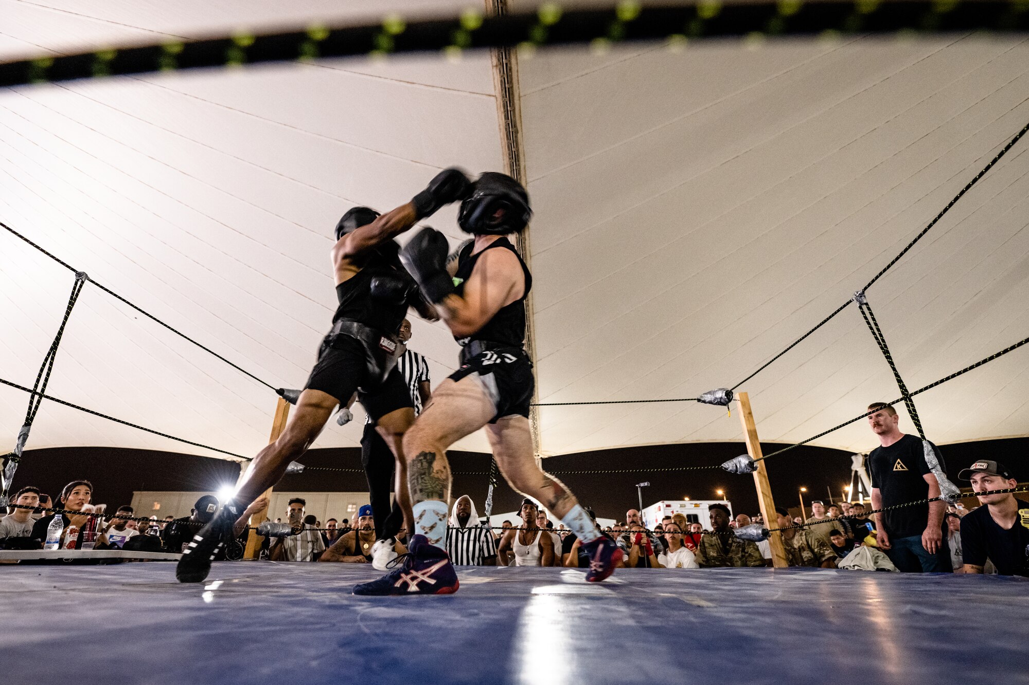 Boxers fighting in a ring