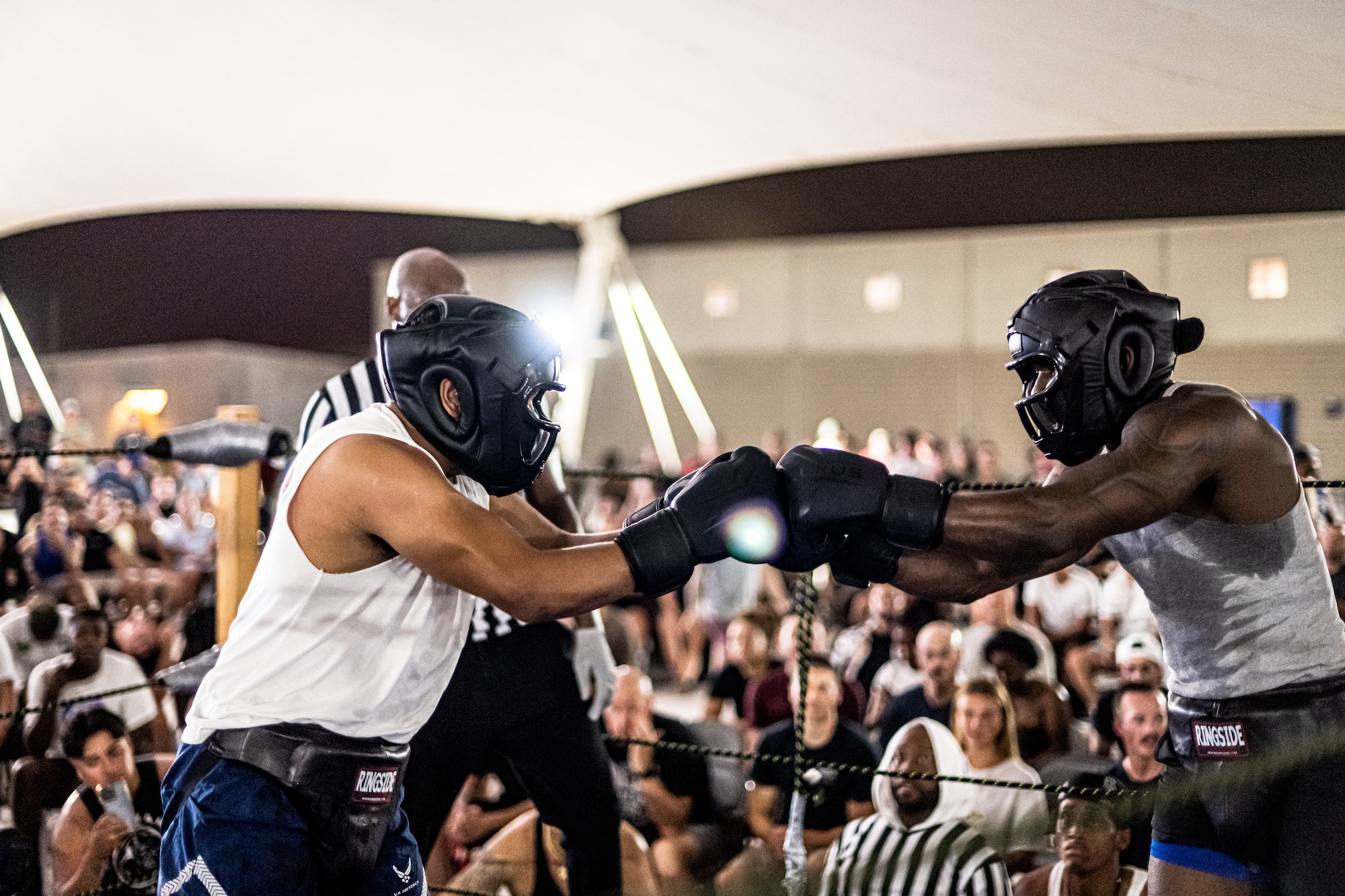 Boxers fighting in a ring