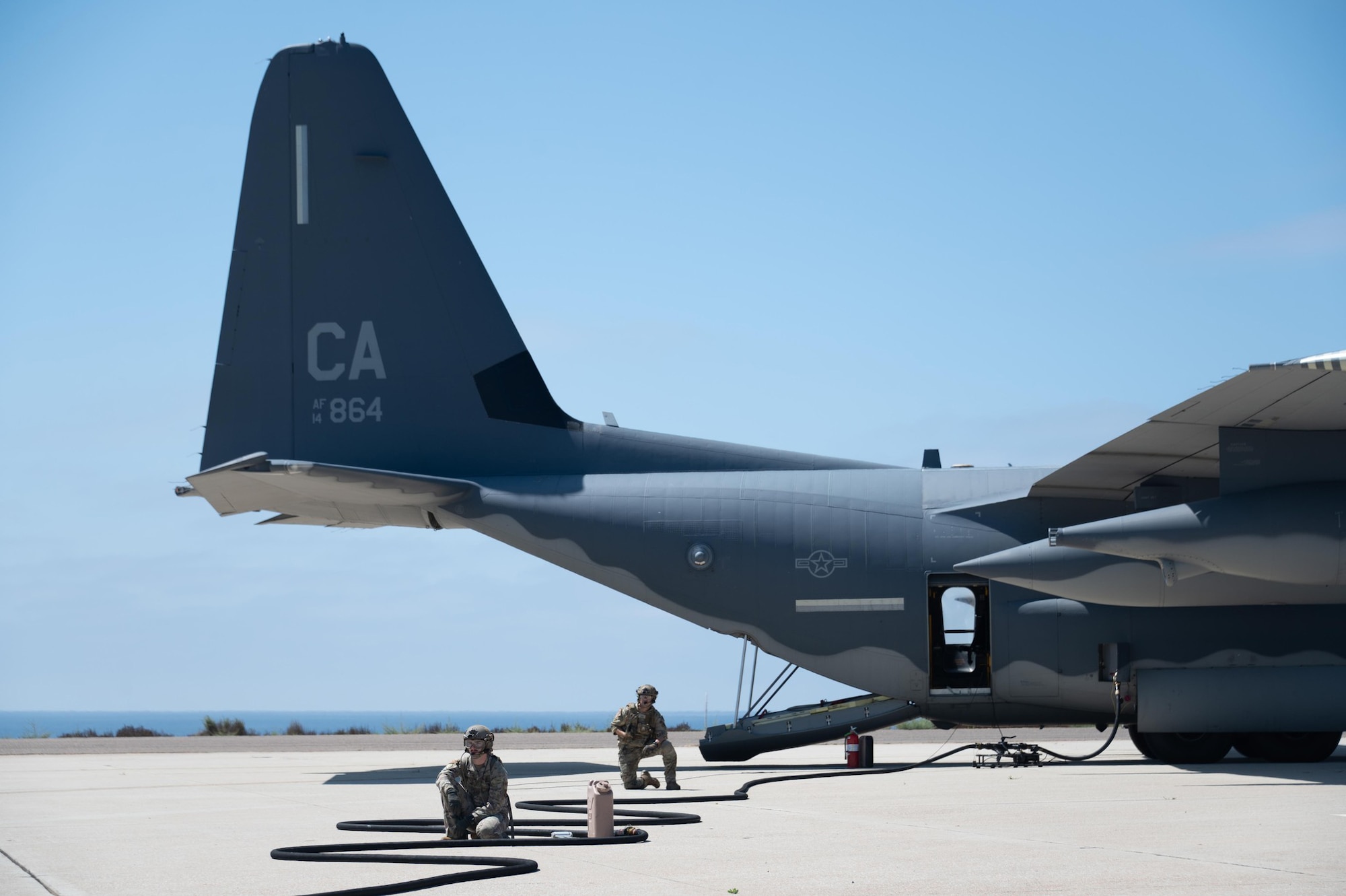 California Air National Guard Forward Area Refueling Point personnel from the 130th Rescue Squadron standby for the MQ-9 Aircraft refuel on the Naval Auxiliary Landing Field on San Clemente Island Calif., Sept. 8, 2023. These personnel simulated the refueling in a contested environment for the Grizzly Flag exercise.