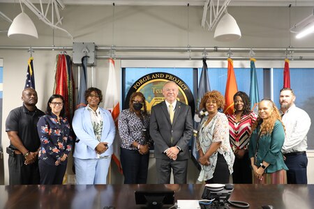 New civilian employees pose with CCoE Deputy to the Commanding General at Fort Eisenhower Ga.