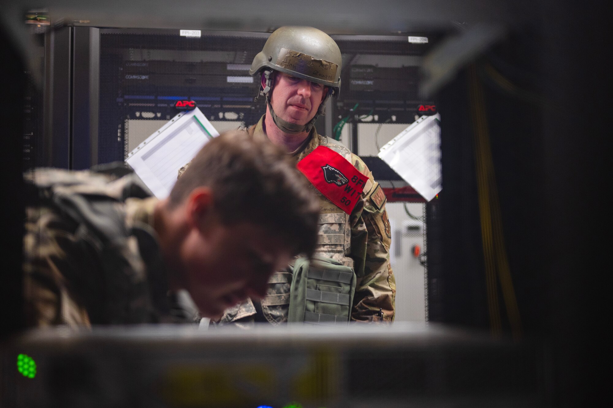 8th Communications Squadron wing inspection team member, oversees Airman troubleshoot network connectivity during a Beverly Pack 23-3 training scenario