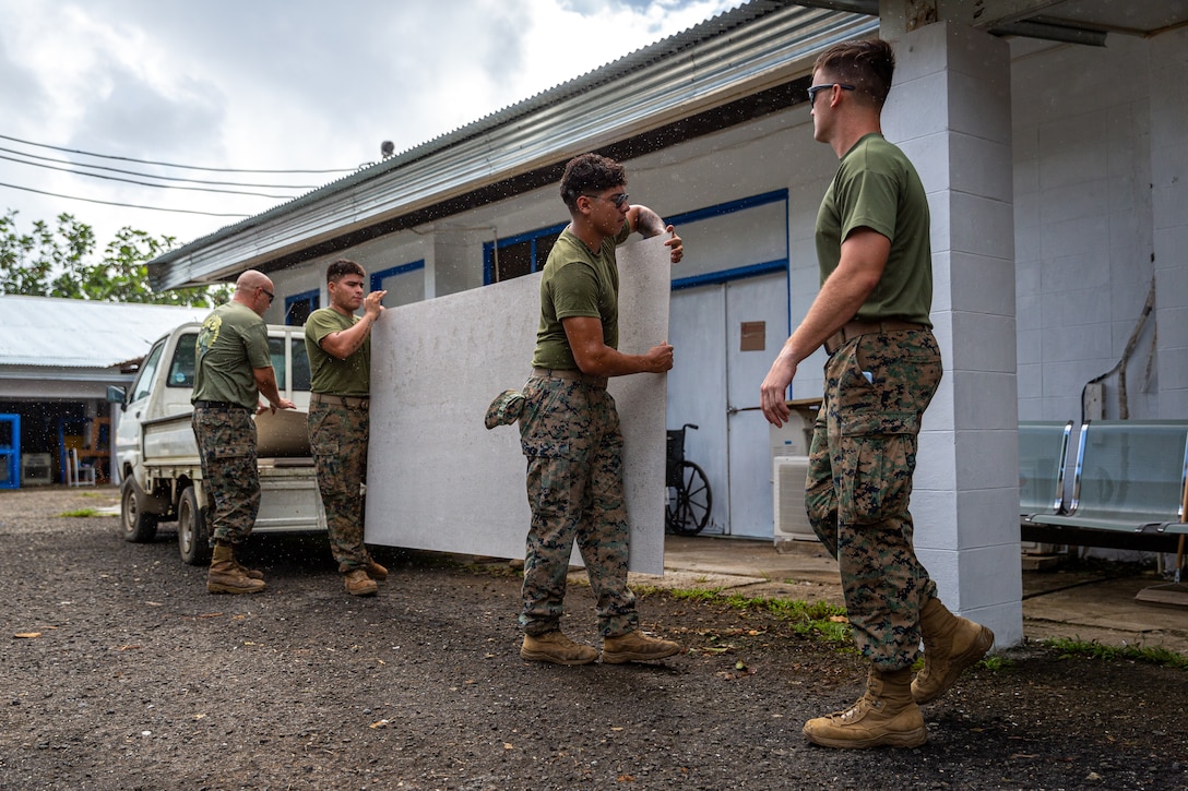 U.S. Marines with Task Force Koa Moana 23 carry wall panels to a work site during a renovation project at the Dr. Arthur P. Sigrah Memorial Hospital on Tofol, Kosrae, Federated States of Micronesia, Sept. 5, 2023. Task Force Koa Moana 23, composed of U.S. Marines and Sailors from I Marine Expeditionary Force, deployed to the Indo-Pacific to strengthen relationships with Pacific Island partners through bilateral and multilateral security cooperation and community engagements.