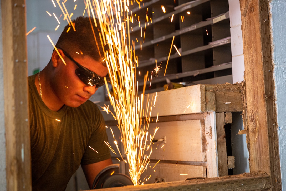 U.S. Marine Corps Lance Cpl. Reyes Castillo, a native of Easton, Pennsylvania and a motor transport operator with Task Force Koa Moana 23, utilizes a grinder during a renovation project at the Dr. Arthur P. Sigrah Memorial Hospital on Tofol, Kosrae, Federated States of Micronesia, Sept. 5, 2023. Task Force Koa Moana 23, composed of U.S. Marines and Sailors from I Marine Expeditionary Force, deployed to the Indo-Pacific to strengthen relationships with Pacific Island partners through bilateral and multilateral security cooperation and community engagements.