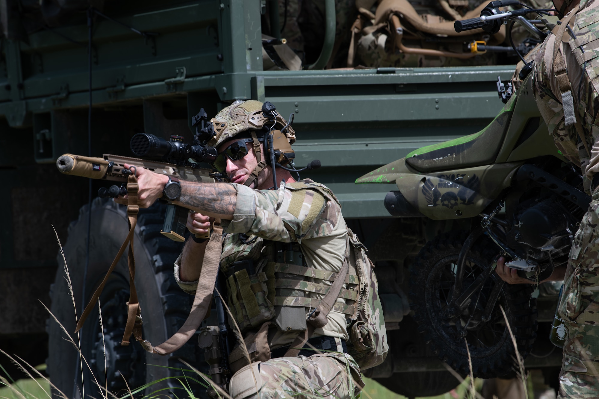 A U.S. Air Force Airman from the 824th Base Defense Squadron provides security for a transport truck at Avon Park Air Force Range, Florida, August 22, 2023. 824th BDS Airmen proved they were ready to provide security and support for upcoming Lead Wing operations through their mission readiness exercise. (U.S. Air Force photo by 1st Lt. Christian Little)