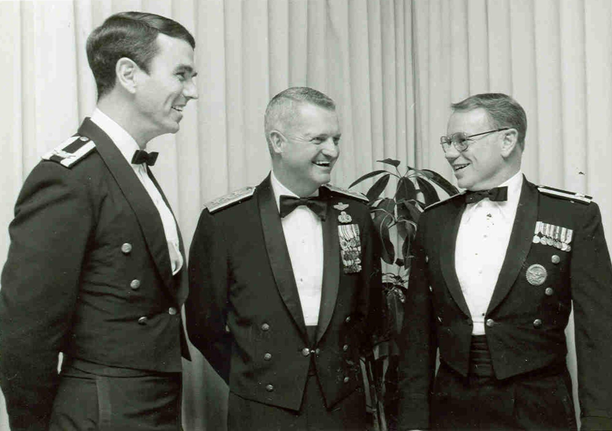 Lt. Gen. Robert Bond, center, visits with fellow attendees of the Arnold Engineering Development Center 1984 Dining-Out held at the Officers’ Open Mess at Arnold Air Force Base, Tenn. Bond, then vice commander of Air Force Systems Command, was a frequent visitor to Arnold. The static F-105 Thunderchief on display outside the Main Gate at Arnold AFB is dedicated to Bond, who was killed on April 26, 1984, when the aircraft he was piloting crashed at Nellis Air Force Base, Nevada. The F-105 was the first static display to be dedicated at Arnold. (U.S. Air Force photo)