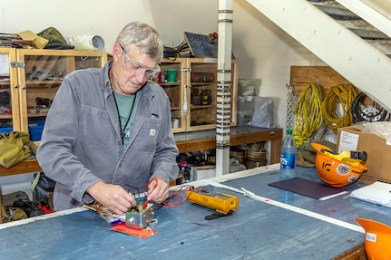 Larry Cramer, electrician, Shop 51, Electricians, began his 36-year career at PSNS & IMF since 1987. That career came to a close Aug. 31, 2023, when he "clocked out" for the final time. (U.S. Navy photo by Jeb Fach)