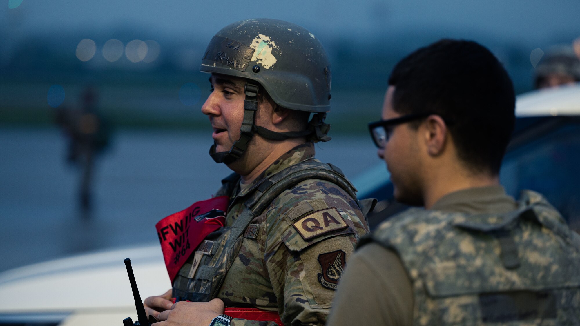 Staff Sgt. Nathaniel, Randall, left, 8th Maintenance Group weapons quality assurance inspector and wing inspection team member, discusses training scenario objectives with 8th MXG Airmen during Beverly Pack 23-3 at Kunsan Air Base