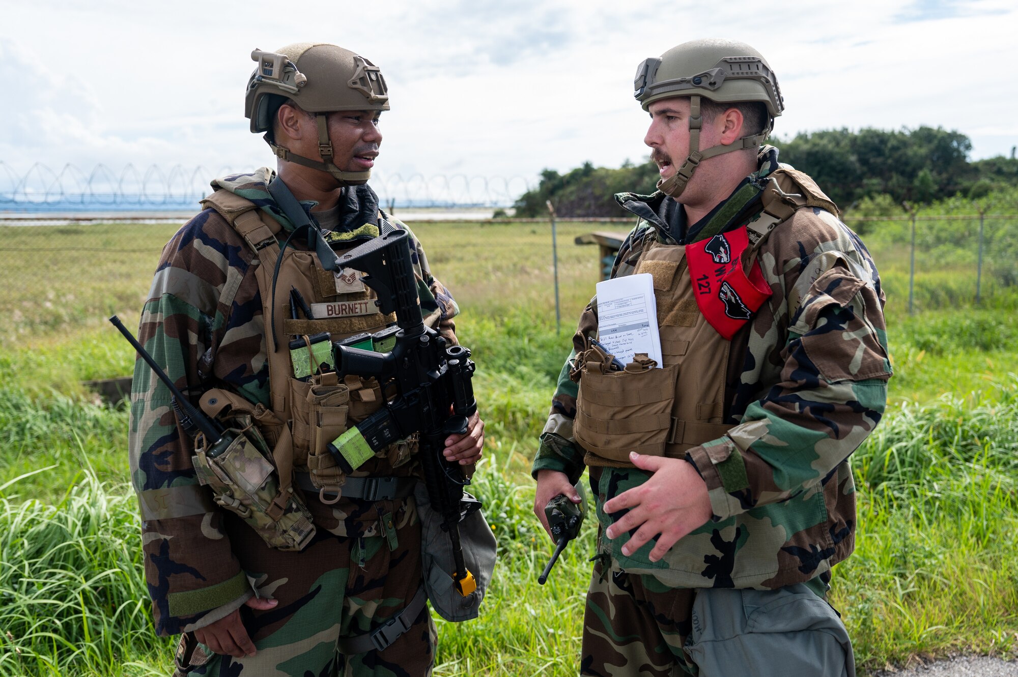 8th Security Forces Squadron wing inspection team member and base defense operations center controller discuss the procedures expected of the base Defenders at Kunsan Air Base